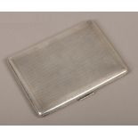 A George V silver cigarette case assayed London 1933 by S. J. Rose & Son, presentation inscription