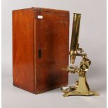 A Beck London brass microscope in mahogany case.