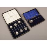 A cased set of 6 silver demitasse spoons with coffee bean terminals, assayed Sheffield 1922 along