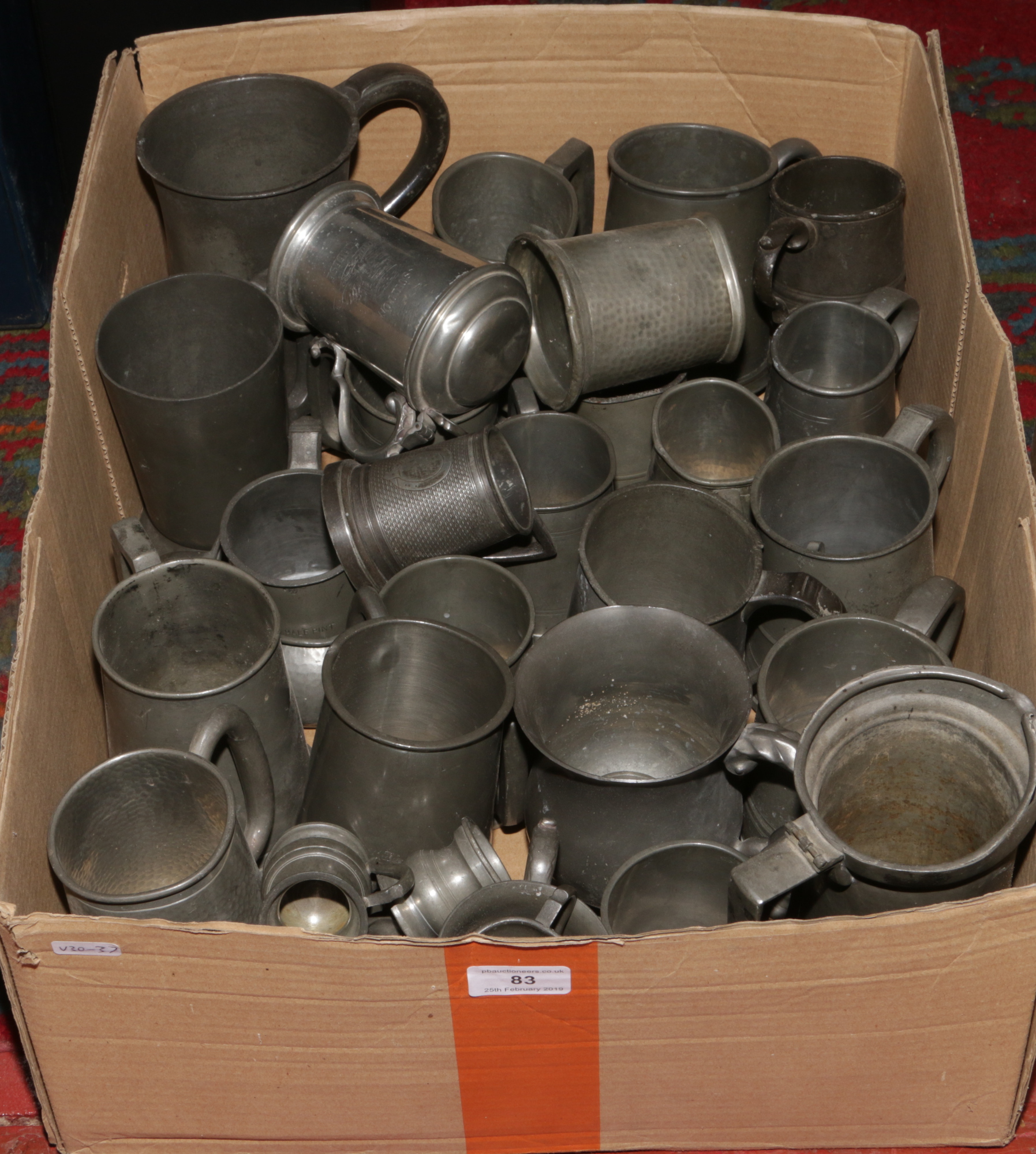 A box of various pewter tankards.