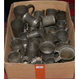 A box of various pewter tankards.