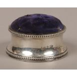 An Edwardian silver pin cushion assayed Birmingham 1902.Condition report intended as a guide only.