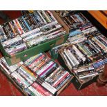 Four boxes of assorted DVDs.