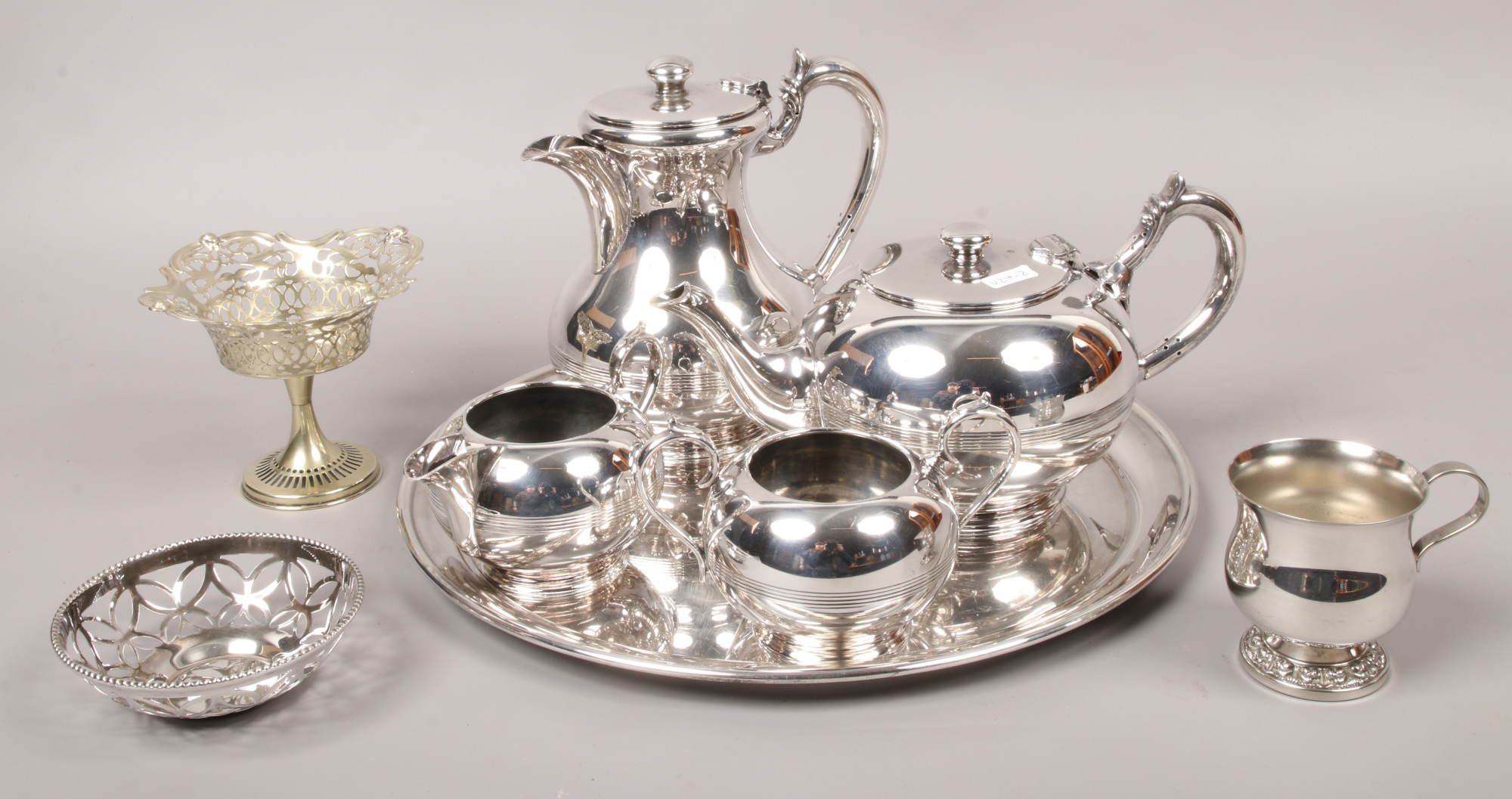 A collection of silver plate to include Walker & Hall tea set on tray, pierced bon bon dish etc.