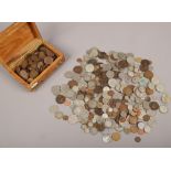 A collection of British and foreign pre-decimal coins, half crowns, florins etc.