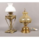 A Hinks & Son oil lamp on ornate brass stand, along with a table lamp formed as an oil lamp.