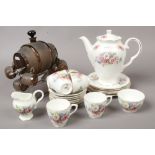 A Royal Stuart six part coffee set with floral decoration, along with a glass Brandy barrel drinking