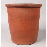 A glazed terracotta pickling jar.