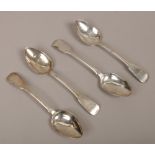 Four Georgian silver dessert spoons, three assayed Dublin 1821 by Joshua Buckton, the other London