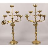 A pair of brass seven branch candelabras.Condition report intended as a guide only.Some damage.