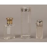 Three silver topped scent bottles largest bottle assayed Chester.