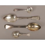 Two monogrammed Georgian silver table spoons assayed London 1825, along with a sifting spoon and