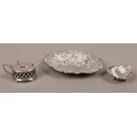 A collection of silver items to include silver pin dish, mustard pot, silver salt, pin dish