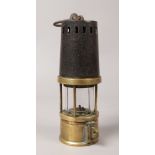 A Johnson Clapham & Morris deflector miners lamp, Howats patents.