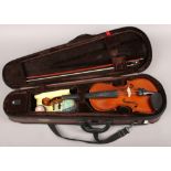 A cased Stentor 1/2 size violin with bow and accessories.