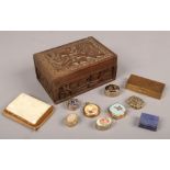 A carved wooden box and contents of pill boxes and a gilt cigarette case with abalone shell inlay.