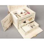 A fitted jewellery box and assorted modern costume jewellery.