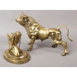 A large brass figure of a bull Height 28cm, along with a decorative brass wall plaque depicting a