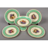 A George Jones & Sons pottery dessert service by W. Birbeck. Gilded, with green ground borders and