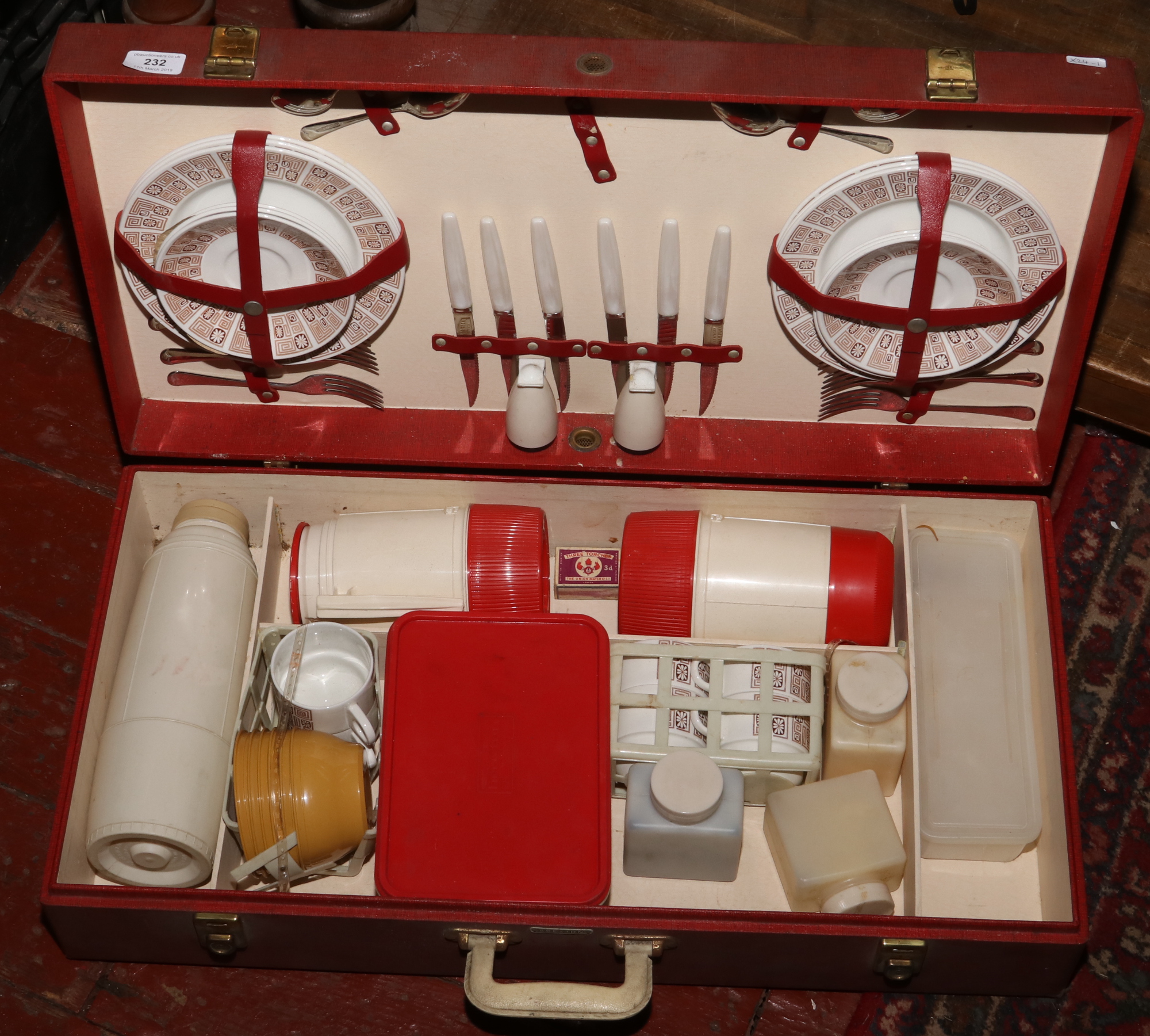 A vintage cased Brexton picnic set including plates, flasks, cutlery, cruet, mugs etc.