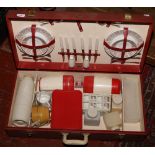 A vintage cased Brexton picnic set including plates, flasks, cutlery, cruet, mugs etc.