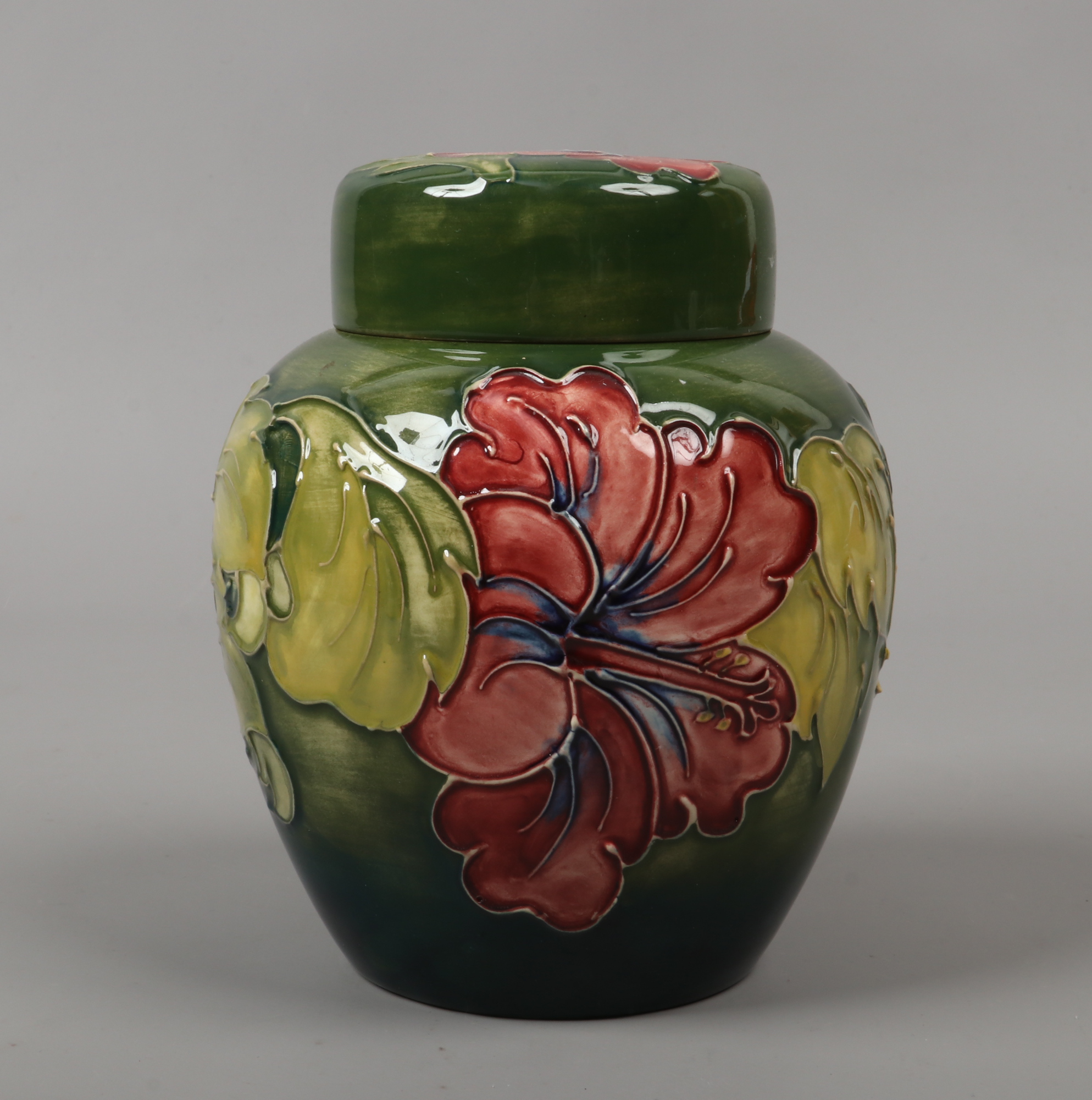 A Moorcroft ginger jar decorated in the Hibiscus pattern.Condition report intended as a guide only.