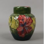 A Moorcroft ginger jar decorated in the Hibiscus pattern.Condition report intended as a guide only.