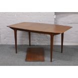 A Macintosh retro teak extending table with extra leaf, along with a matching set of four plus two