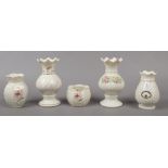 Four modern belleek vases along with a Donegal example.