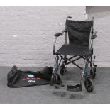 A Travelite drive folding wheel chair in carry bag.