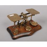 A set of post office letter scales and weights.