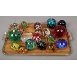 A tray of 19 glass paperweights.