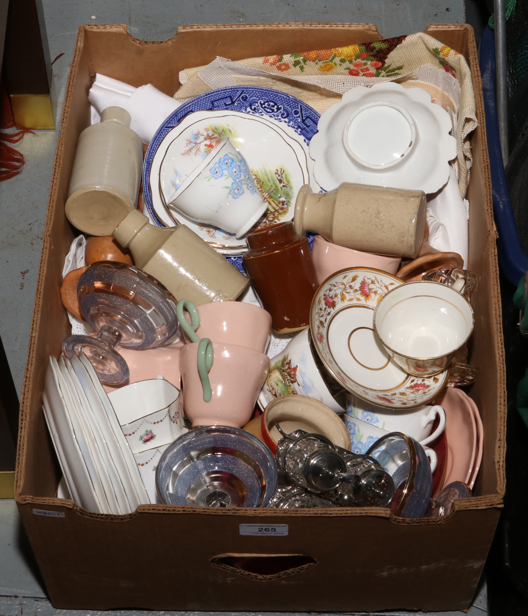 A box of miscellaneous to include lace and linen, bone china teawares, Doulton Lambeth stoneware