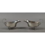 A matched pair of silver sauceboats by Charles Green assayed Birmingham 1958-62, 221 grams.