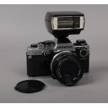 An Olympus OM10 35mm SLR camera with OM- System Zuiko 50mm 1: 1,8 Auto-S lews and a Electronic hot