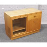 A Turnidge teak hi fi cabinet with record cupboard.