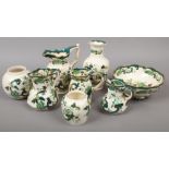 Eight pieces of Masons Chartreuse design ceramics to include a set of four graduated jugs, fruit