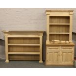 A large limed oak kitchen dresser, height 205, width 107, depth 66cm with damage to cornice. Along