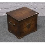 A carved oak Art Deco coal / log box with metal mounts and tin liner.