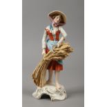 A Goebel figure emblematic of the harvest depicting a maiden with a corn stook and scythe.
