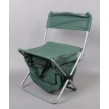 A folding fishing seat along with a folding camping chair in carry bag.