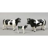 A Beswick Friesian cattle set cow, bull and calf including Champion Coddington hilt bar and Champion