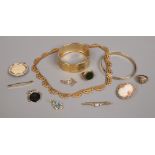A quantity of yellow metal jewellery including bangles cameo and bar brooches, scarf clip,