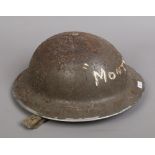 A World War I metal Brodie helmet.