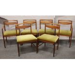 A set of four plus two carver arm McIntosh & Co. Limited retro teak dining chairs.