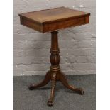 A Victorian carved mahogany lectern raised on lion paw feet.