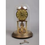 A brass 400 day anniversary clock, maker Kundo, Germany. Under glass dome and with a key.