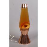 A rose gold coloured lava lamp, height 41cm.