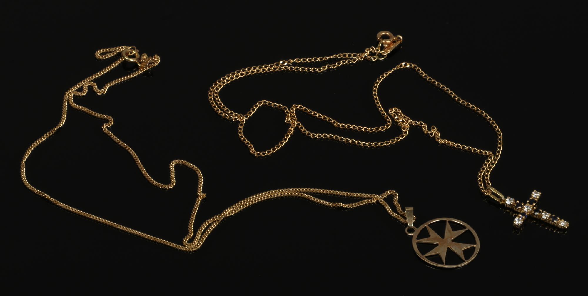 Two 18ct gold chains. One with an 18ct gold crucifix pendant, the other a 9ct gold Maltese cross