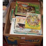 A box of jigsaws to include happy hour, Robin Hood etc.